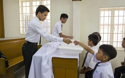Why can only males pass the Sacrament?